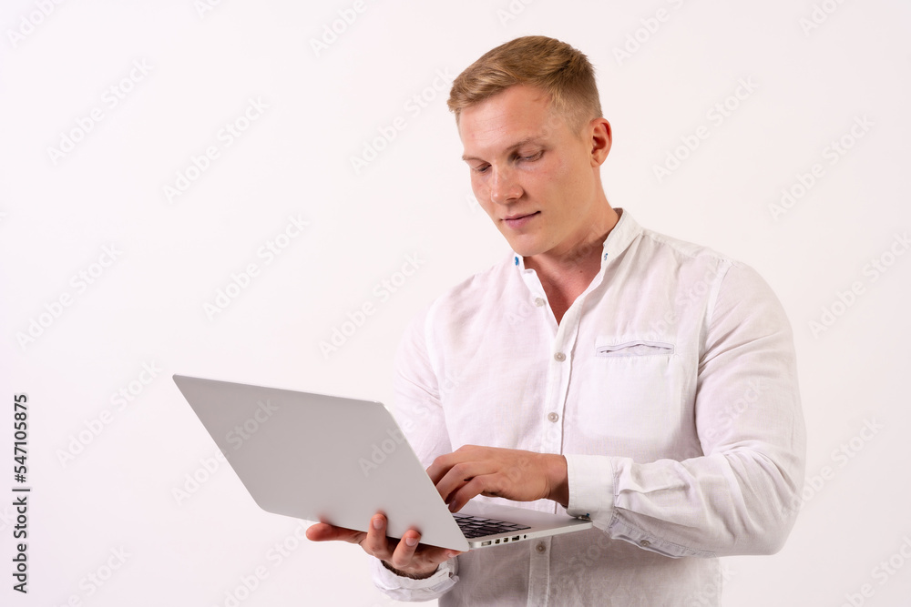 Caucasian businessman man with a laptop working on a white background Caucasian businessman man with a laptop working on a white background