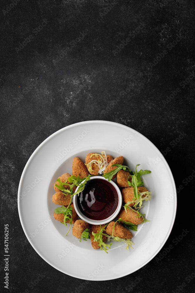 Cheese nuggets with sauce on a plate Cheese nuggets with sauce on a plate