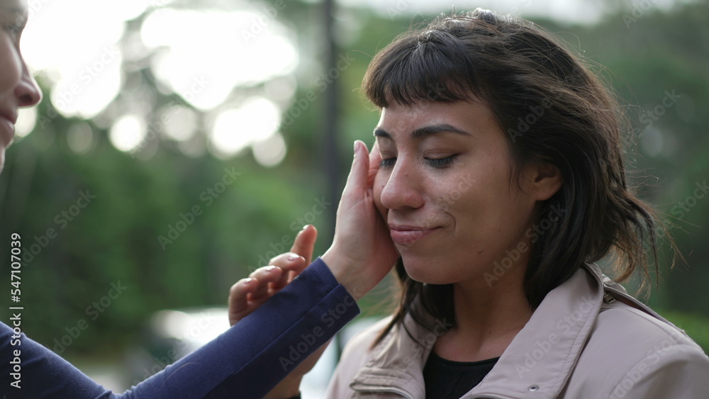 Two friends hugging each other standing outside with EMPATHY and SUPPORT. Friendship concept of female friend EMBRACING suffering person2 Two friends hugging each other standing outside with EMPATHY and SUPPORT. Friendship concept of female friend EMBRACING suffering person2