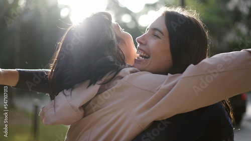 Photos Two happy female best friends hugging each other