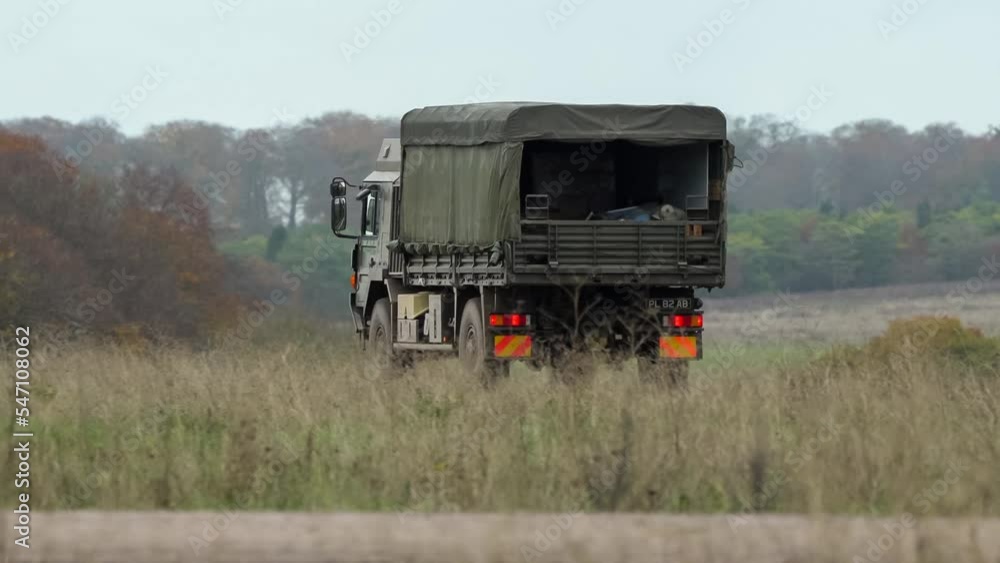 British army MAN SV 4x4 logistics lorry truck travelling at speed along a dirt track on a military exercise, Wilts UK British army MAN SV 4x4 logistics lorry truck travelling at speed along a dirt track on a military exercise, Wilts UK