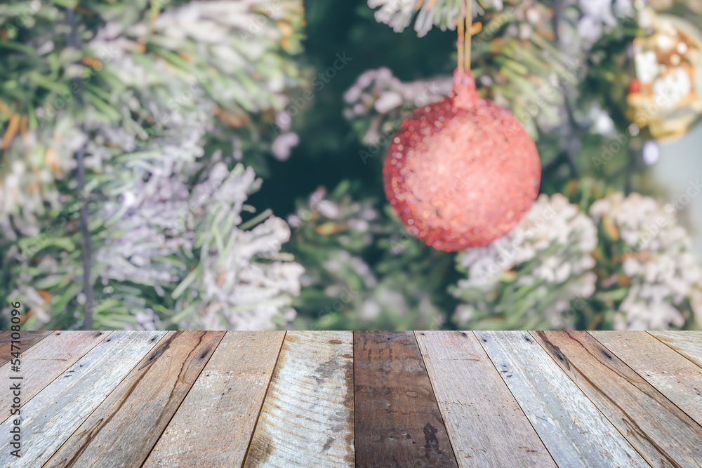 Empty wood table top with blur Christmas tree with bokeh light background