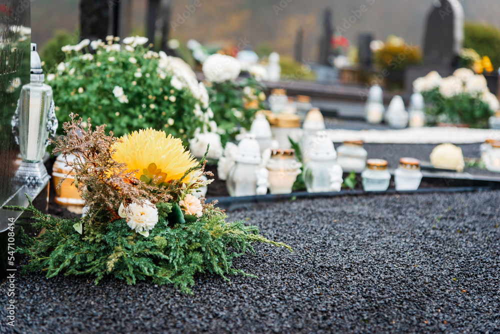 All Saints' Day and burning candles and flowers on the graves.Candles