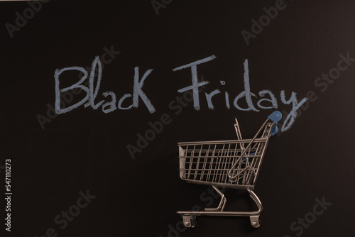 shopping cart on black background and text