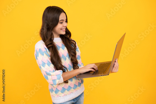 Student teenager schoolgirl with laptop on isolated background. Online webinar, elearning lesson, pc computer.