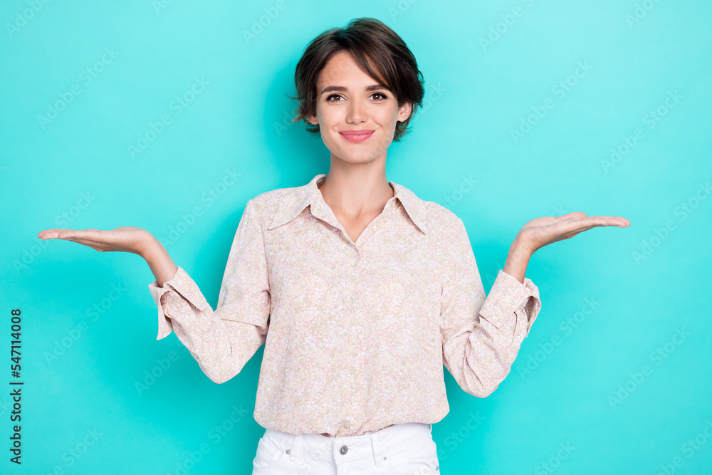 Portrait photo of young attractive adorable cute nice girl office worker promoter choose between two different product isolated on aquamarine color background Portrait photo of young attractive adorable cute nice girl office worker promoter choose between two different product isolated on aquamarine color background