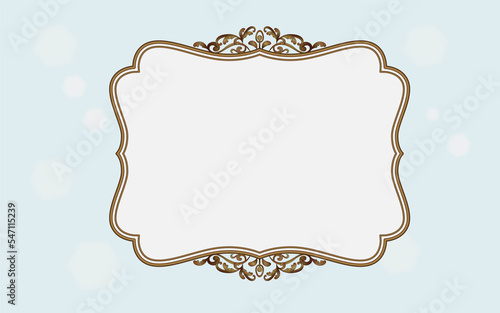 Blank vintage gold frame on light blue background.