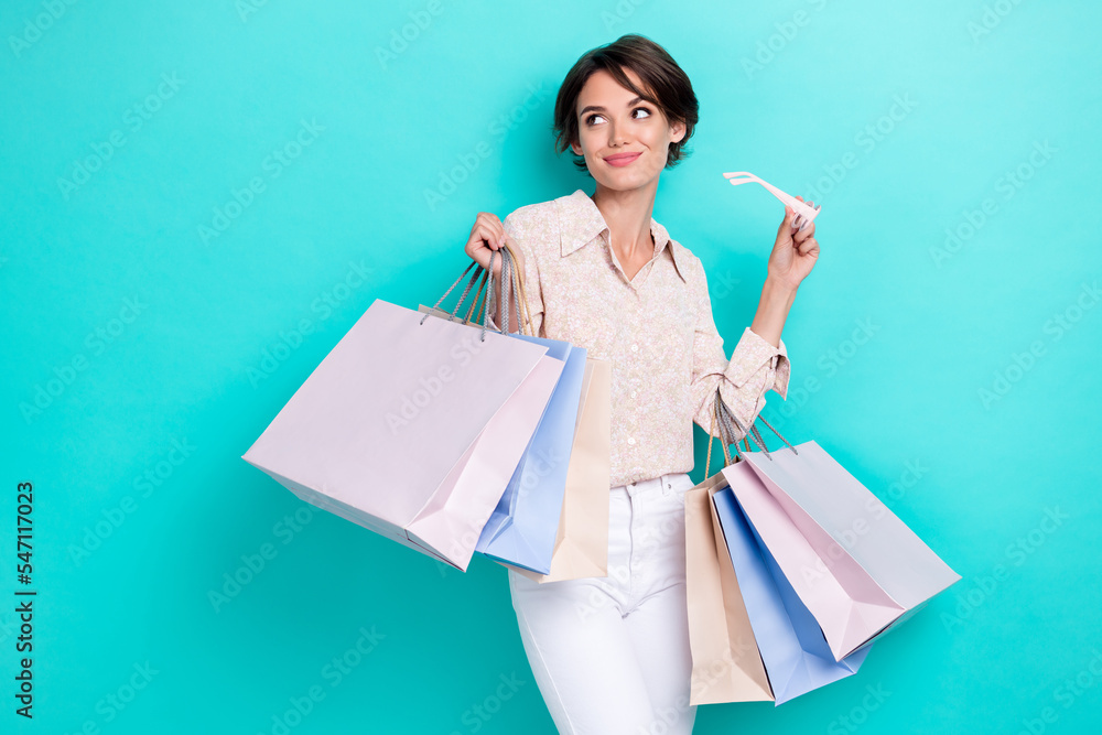 Photo of pretty lady hand hold bags spectacles look empty space promo banner boutique big sale low price isolated on cyan color background Photo of pretty lady hand hold bags spectacles look empty space promo banner boutique big sale low price isolated on cyan color background