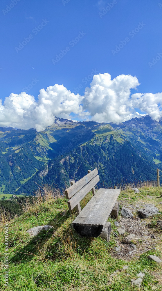 Wooden bench on top of a Mountain without people