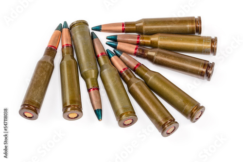 Tracer rifle cartridges with green tip on a white background