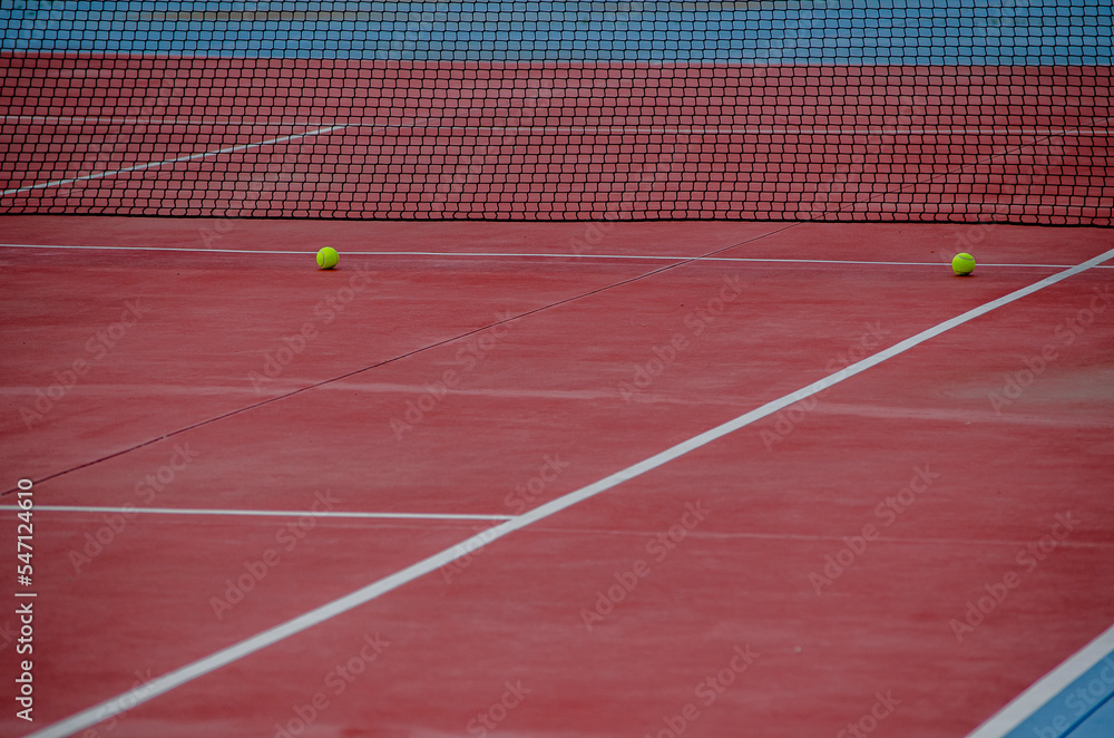 selective focus, two balls on a tennis court. sports courts