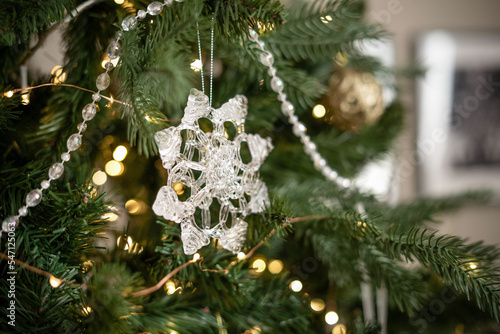 Crystal snowflake Christmas toy on the Christmas tree.
