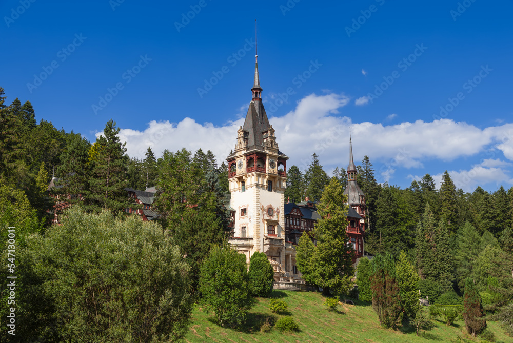 Located on the southern sunny slope of hill, surrounded by centuries-old coniferous and deciduous trees, open to sky and sun, Peles Castle is pearl in this bosom of nature, Sinaia, Romania 