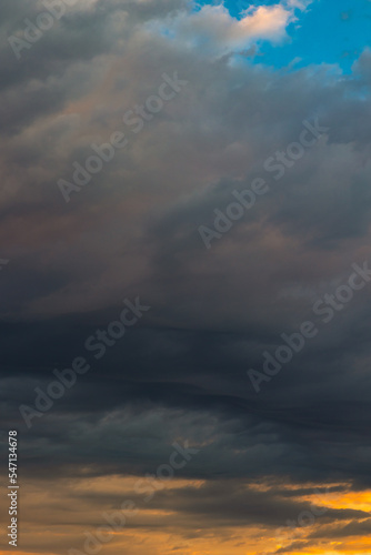Dramatic clouds at sunrise or sunset. Cloudscape vertical photo © senerdagasan