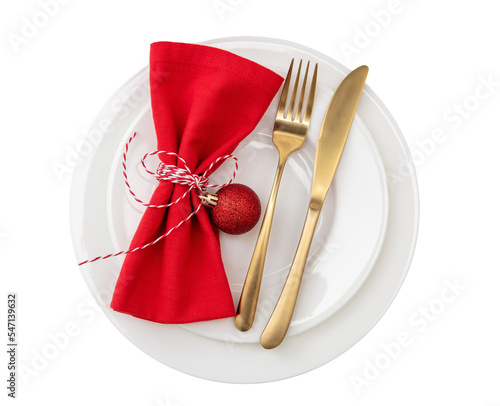 Christmas table setting, celebration dinner. Golden Cutlery and red cloth napkin isolated on transparent background, PNG, photo