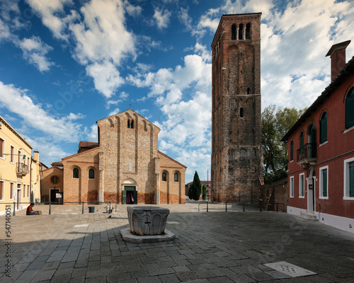 Murano, Venezia. Piazza con la Basilica di Santa Maria e Donato con il campanile e vera da pozzo photo