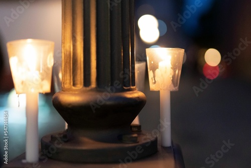 Closeup shot of lit candles on Christmas photo