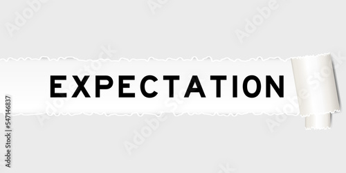 Ripped gray paper background that have word expectation under torn part