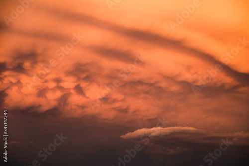 Dramatic clouds formations during a colorful sunset after a summer storm