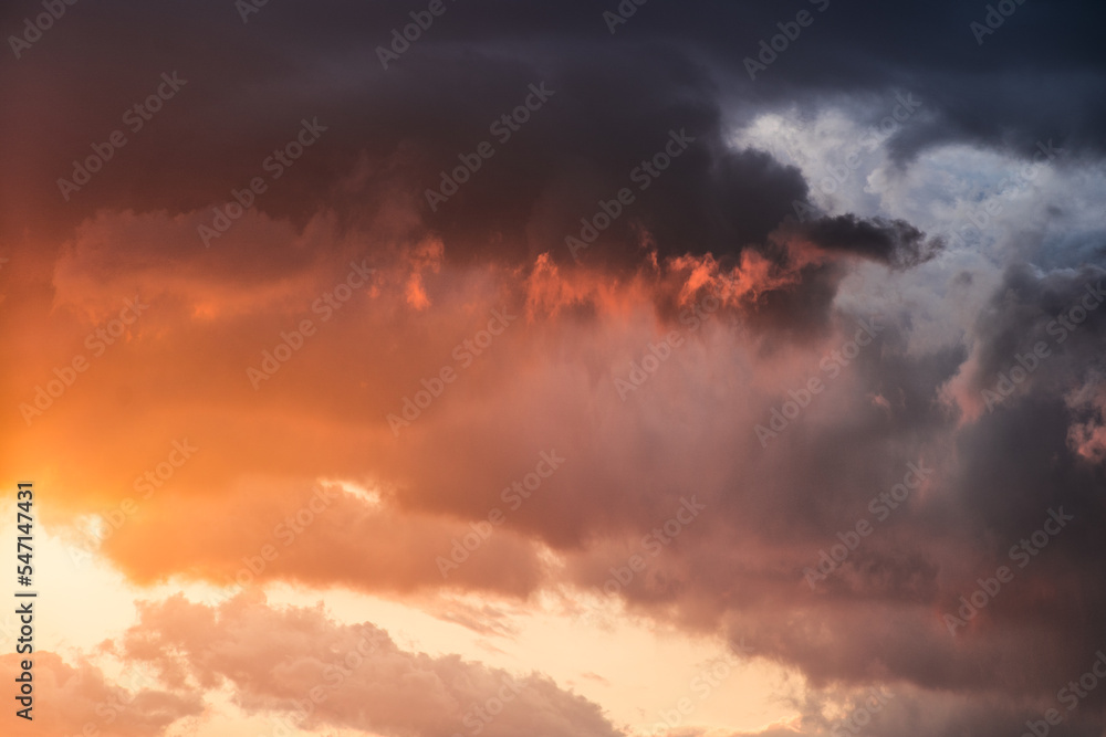 Dramatic clouds formations during a colorful sunset after a summer storm