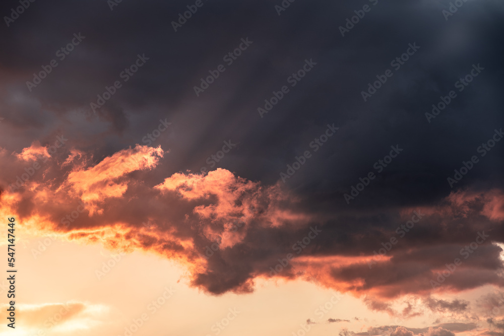 Fototapeta premium Dramatic clouds formations during a colorful sunset after a summer storm