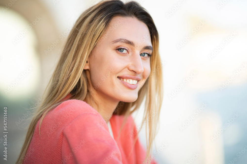Close up smiling young woman with blond hair and blue eyes Close up smiling young woman with blond hair and blue eyes