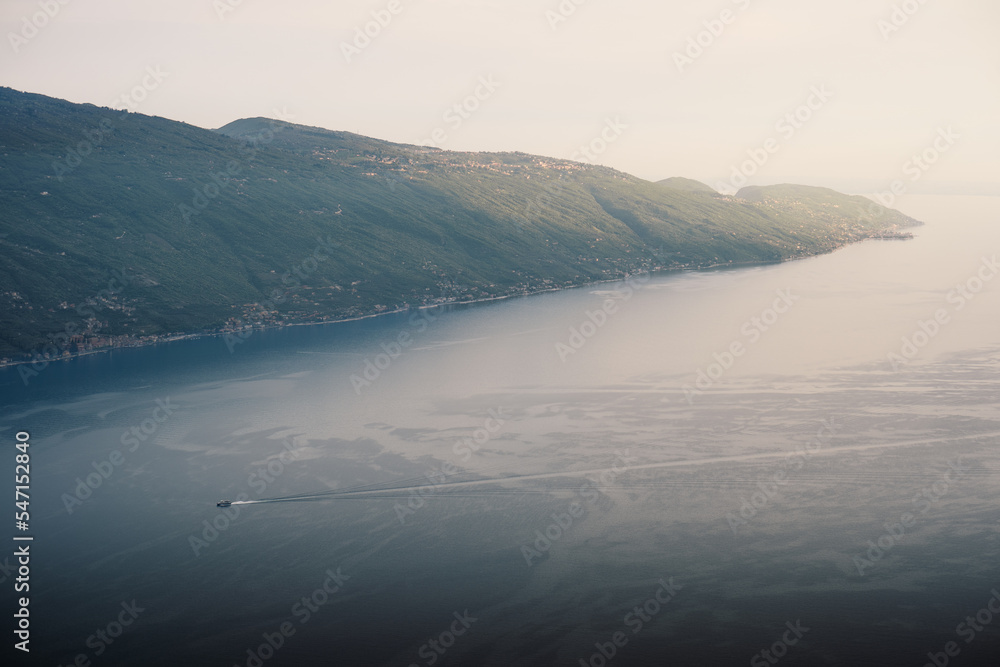 Aerial view of the east coast of Lake Garda, with some sunlight shining on the hills Aerial view of the east coast of Lake Garda, with some sunlight shining on the hills