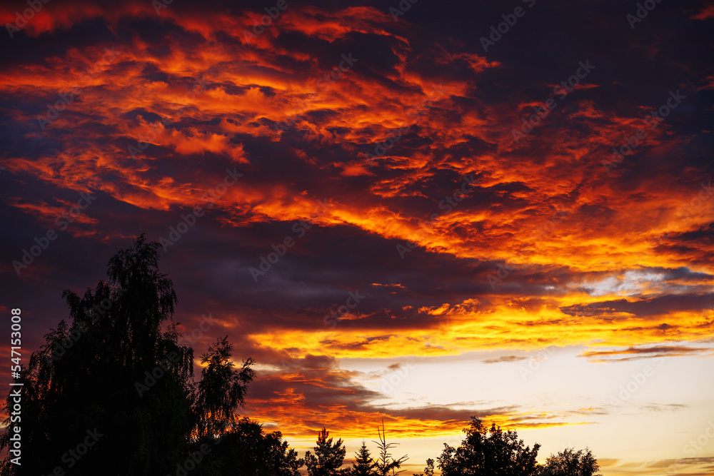 Fototapeta premium Dramatic red clouds during sunset.