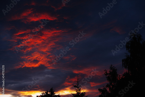 Dramatic red clouds during sunset. © Barillo_Picture