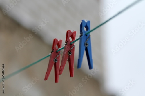 Clothespins in the snow on a rope