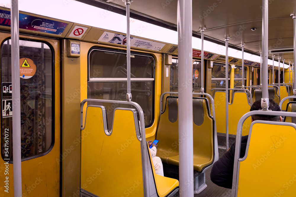 A metro wagon from inside with empty seats in Brussels
