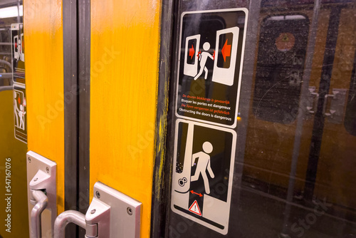 View of the inside of a subway train with the door closed in Brussels