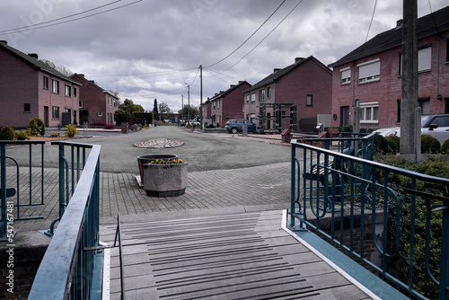 Cars parked on the roadside by Kleine Gete river in Zoutleeuw photo