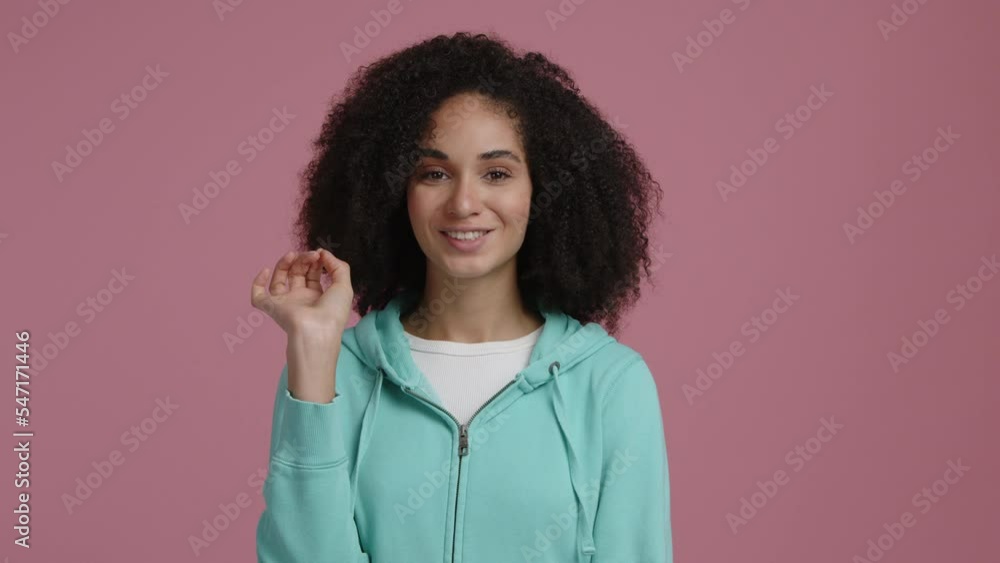 Portrait of a beautiful mixed race woman making a silence gesture. Young, carefree lady showing that she can keep a secret. High quality 4k footage Portrait of a beautiful mixed race woman making a silence gesture. Young, carefree lady showing that she can keep a secret. High quality 4k footage