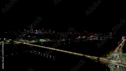 Aerial night view of empty highway and interchange Warsaw Europe after epidemic lockdown. Cityscapes with disappearing traffic on streets. Roads and lanes crossroads photo