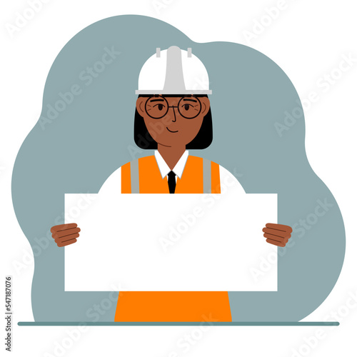 Engineer woman holding a blank sheet of paper. The concept of a builder, engineer, planner or designer.