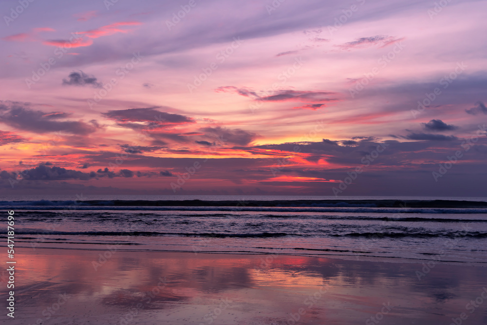Beautiful colorful sunset over the Indian Ocean in Bali, Indonesia. Desktop wallpaper. Nature. Travel concept.