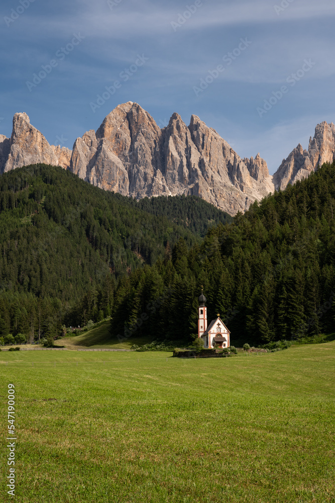 A church below the mountains