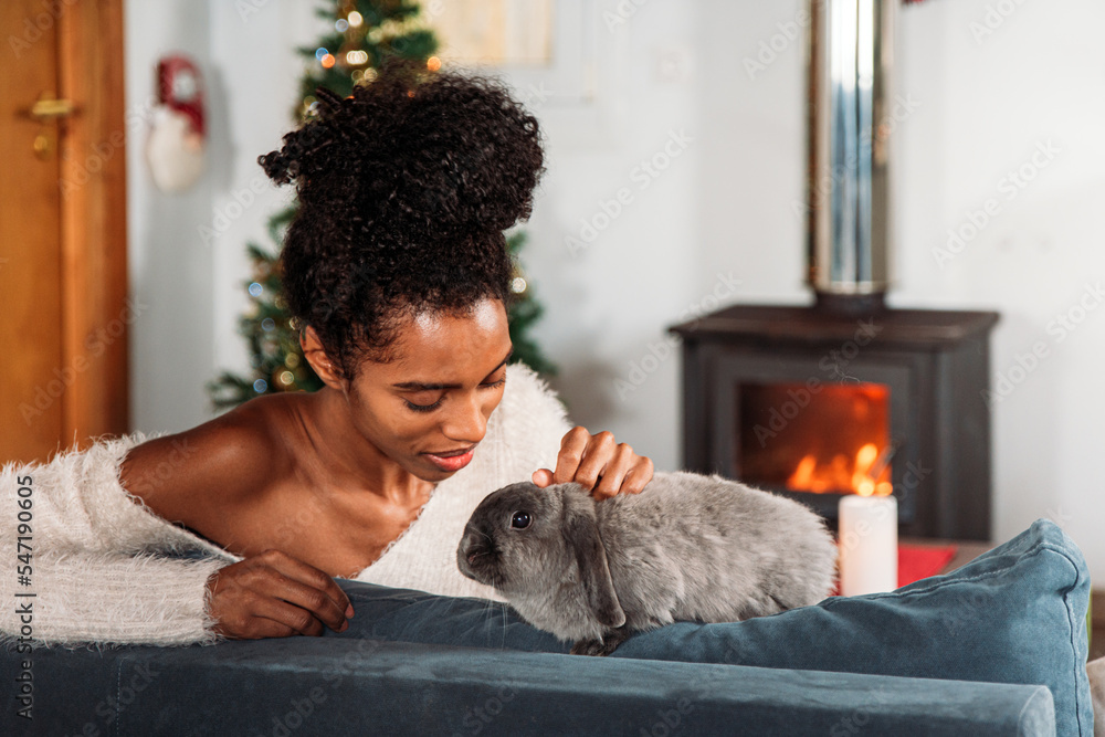 Black woman with rabbit on Christmas Black woman with rabbit on Christmas