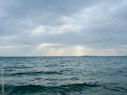 dark cloudy sky at the sea, cloudy sea horizon © Oksana