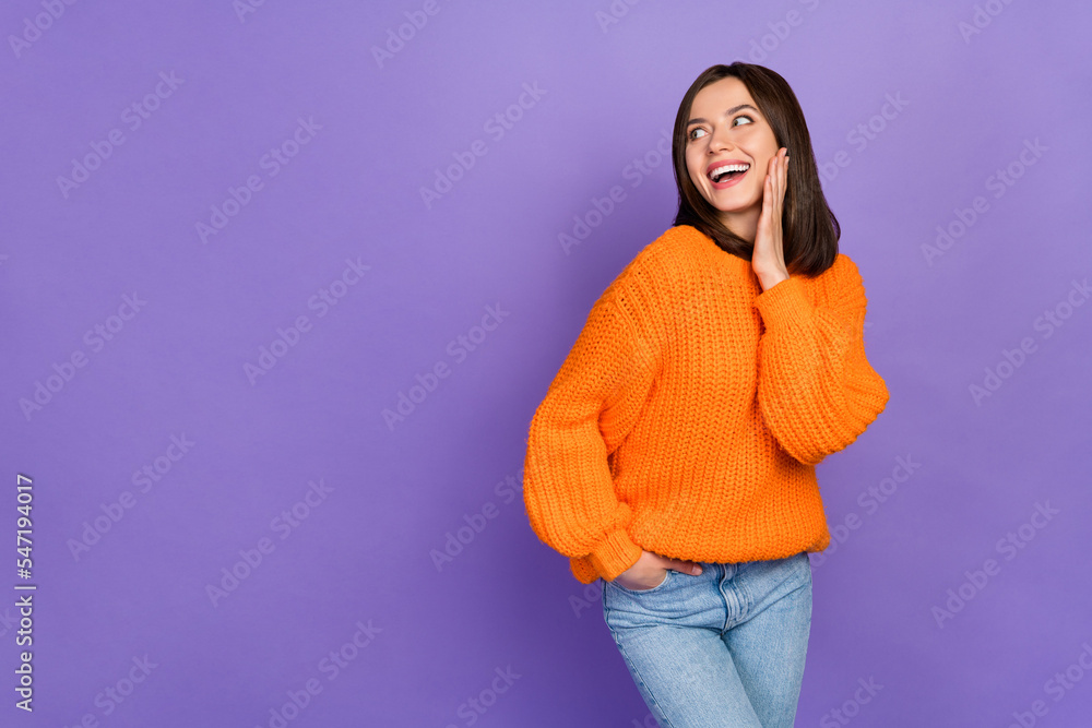 Portrait of gorgeous cheerful girl hand touch cheek toothy smile look empty space isolated on purple color background Portrait of gorgeous cheerful girl hand touch cheek toothy smile look empty space isolated on purple color background