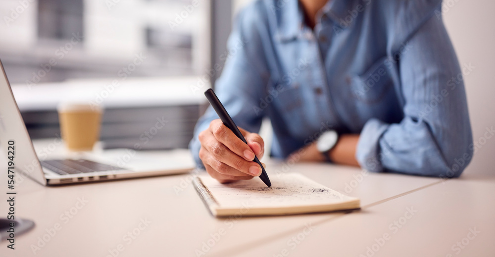 Close Up Of Businesswoman In Modern Office Working On Laptop Making Notes In Notebook Close Up Of Businesswoman In Modern Office Working On Laptop Making Notes In Notebook