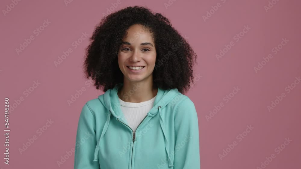 Close-up shot of attractive lady smiling happily. Cheerful, mixed race female laughing while looking at camera. High quality 4k footage Close-up shot of attractive lady smiling happily. Cheerful, mixed race female laughing while looking at camera. High quality 4k footage