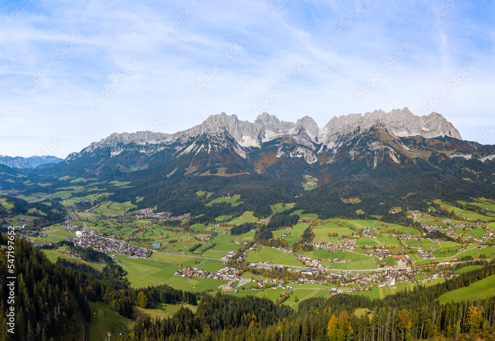 Aerial panorama image of the Wilder Kaiser mountain range and the villages in the valley, Tirol, Austria