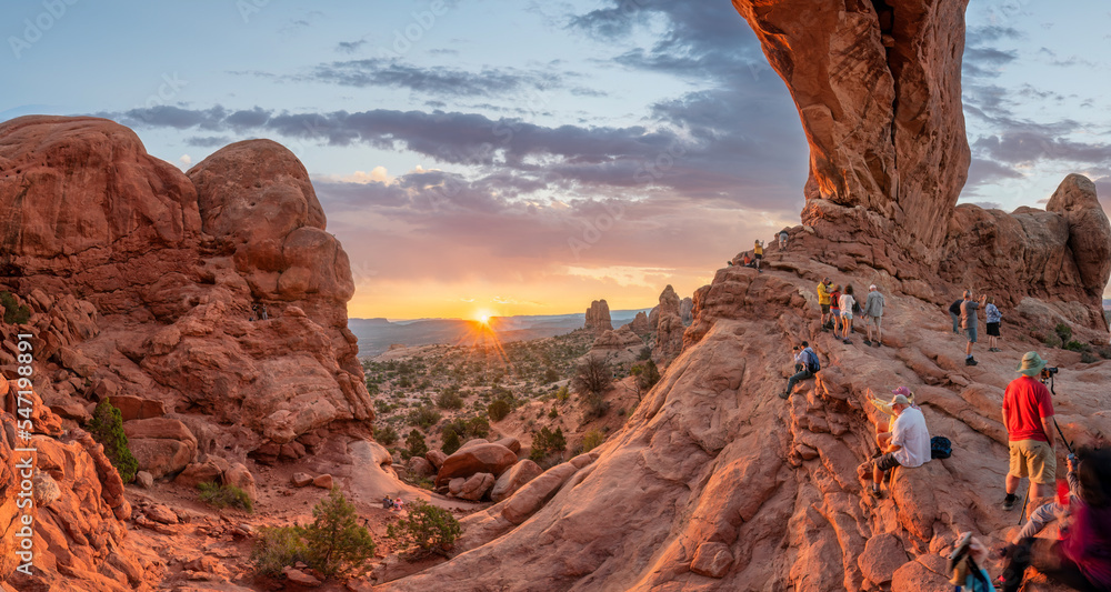 Crowds to watch the Sunrise at the North Window Arch at Arches National Park - Windows Trail 