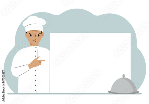 A male cook in uniform and a cap holds a large sheet of paper. Concept for menu, recipe book, blank cookbook or records.