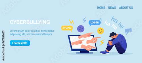 Cyber Bullying. Sad teenage man sitting in front of computer with dislike in social media, mockery. Depressed young person after insult, swear, verbal abuse in internet. Depression, stress concept