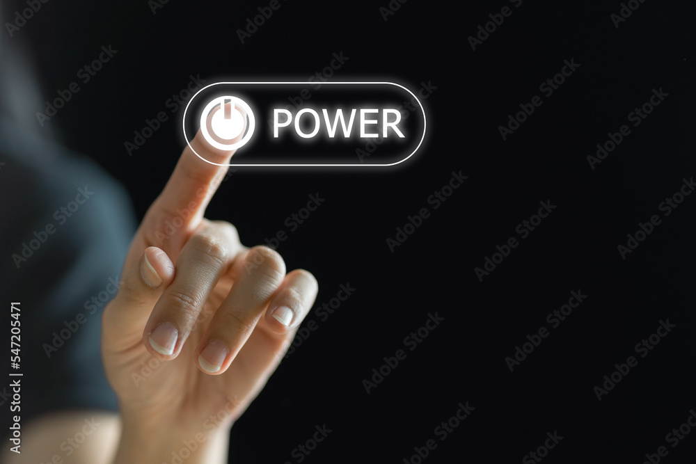 Finger press power button on virtual touch screen, modern technology concept. Finger press power button on virtual touch screen, modern technology concept.