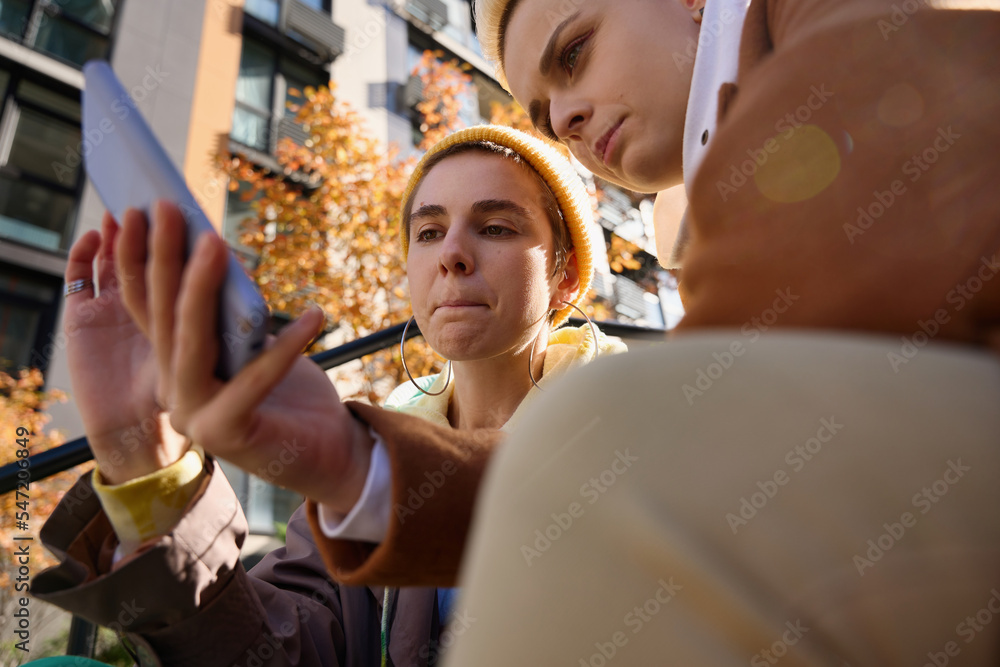 Women are looking at photos on the phone