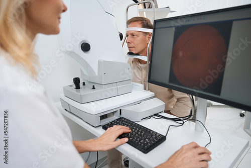 Close-up photo of ophthalmologist testing patient eyes